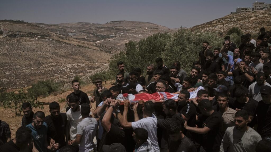 Israeli settlers rampage at a military base in the West Bank