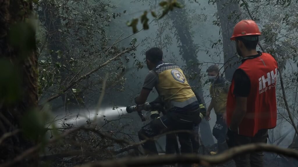 ‘We belong to this land’: Syrians navigate landmines to battle wildfires