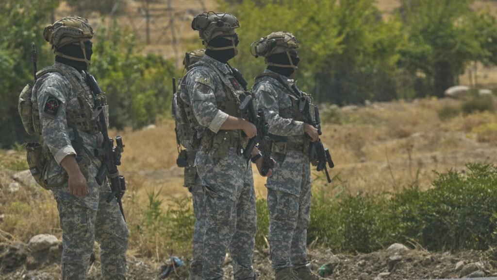 Kurdish separatist fighters in Iraq begin laying down weapons as part of peace process with Turkey