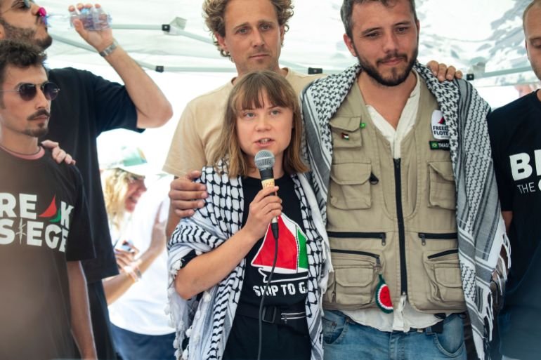 Climate activist Greta Thunberg flanked by Thiago Avila from a human rights organization meets with journalists in Catania, Italy, Sunday, June 1, 2025, ahead of their departure for the Mideast. (AP Photo/Salvatore Cavalli)