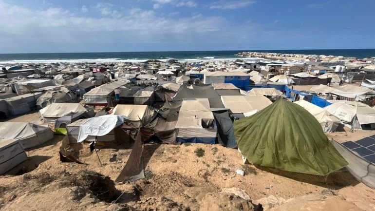 Tents housing displaced Palestinians stretch across the coastal sands of Al-Mawasi,Gaza Strip,