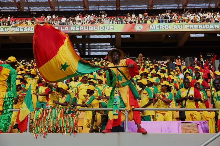 Senegal's supporters cheer ahead of a World Cup Group B qualifying soccer match between Senegal and Mauritania