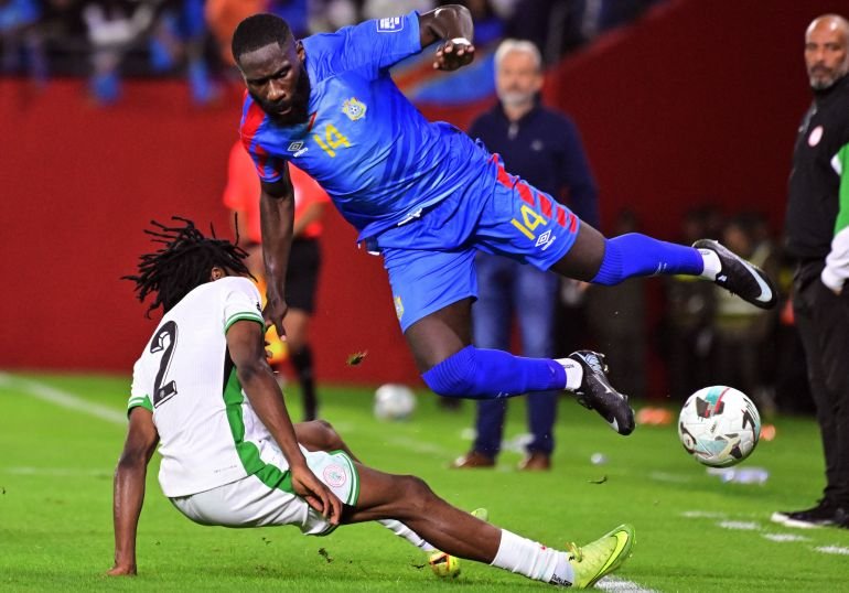 Soccer Football - FIFA World Cup - CAF Qualifiers - Playoffs - Final - Nigeria v Democratic Republic of Congo - Prince Moulay Hassan Stadium, Rabat, Morocco - November 16, 2025 Democratic Republic of Congo's Arthur Masuaku in action with Nigeria's Benjamin Fredrick REUTERS/Abdelmjid Rizkou