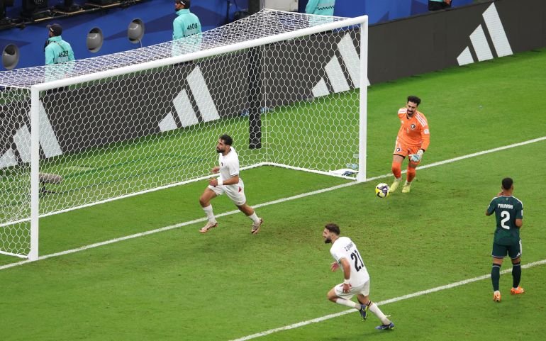 Palestine's Oday Dabbagh celebrates scoring their first goal with Palestine's Zeid Qunbar