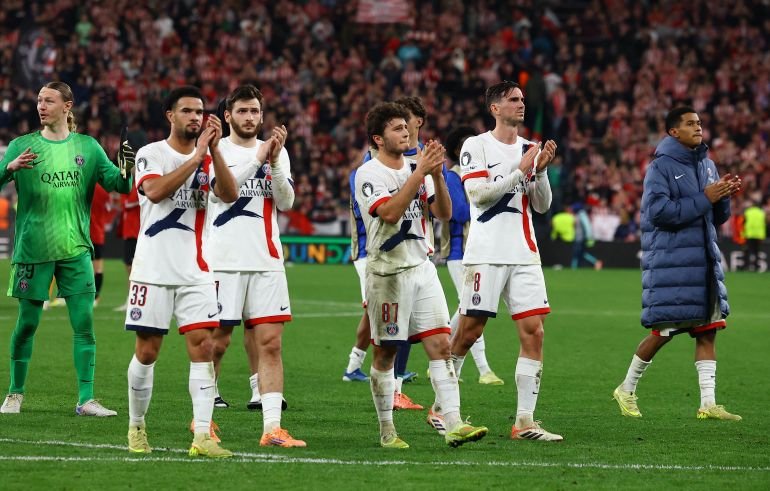 Paris St Germain's Warren Zaire-Emery, Khvicha Kvaratskhelia, Joao Neves and Fabian Ruiz applaud fans after the match