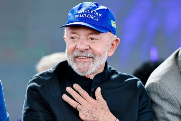 Lula in a blue baseball cap that reads: Brazil for Brazilians.