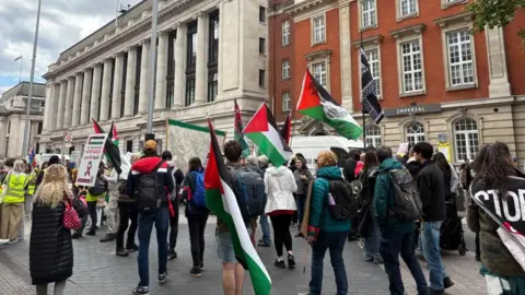 PA Media People gather waving flags for the pro-Palestinian rally