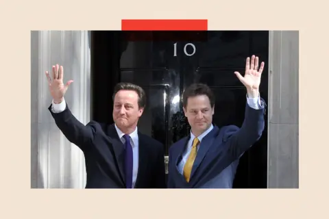 Getty Images David Cameron and Nick Clegg (R) at Downing Street, waving