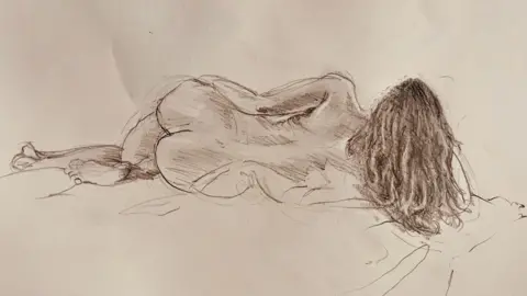 Supplied A charcoal sketch of Hollie lying on a blanket as she poses for a life drawing class.