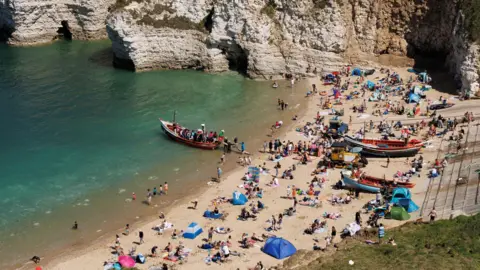 Getty Images Beachgoers at Flamborough's North Landing beach on Tuesday