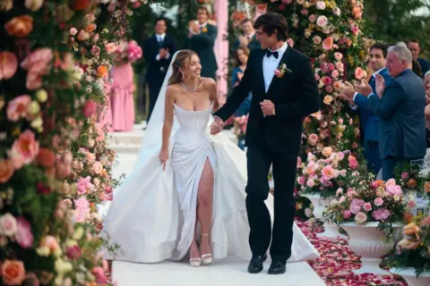 Patrick Wymore/HBO Cassie and Nate walking down the aisle 