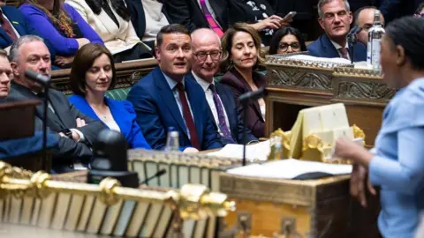 PA Media Handout photo issued by the House of Commons of the Leader of the Opposition, Kemi Badenoch, watched by Health Secretary Wes Streeting and others on the Government Front Bench, during the debate on the King's Speech in the House of Commons, London, following the State Opening of Parliament.
