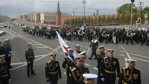Getty Images A marching band parades through the streets of Moscow