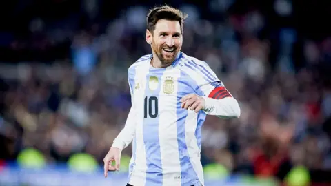 Getty Images Lionel Messi on the pitch wearing Argentina's jersey