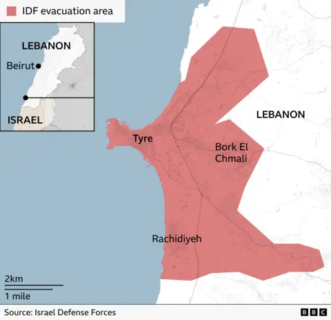 Map showing an area of southern Lebanon around the coastal city of Tyre shaded in red to indicate area the Israel Defence Forces are suggesting be evacuated, extending inland to Bork El Chmali and south towards Rachidiyeh. An inset map locates the area within Lebanon, near the border with Israel.
