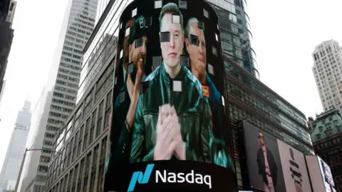 Reuters Elon Musk appears on a large curved billboard in New York with the Nasdaq logo as his SpaceX company goes public.