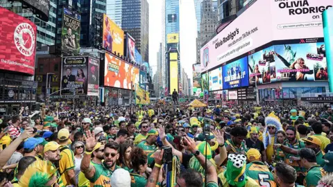 Getty Images Fans of Brazil gather in Times Square for a meetup a day ahead of the match between Brazil and Morocco on 12 June