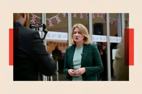 Bloomberg via Getty Images Katie Lam, UK lawmaker, speaks to members of the media at the Conservative Party conference in Manchester