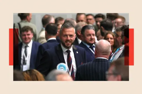 Reuters Reform UK candidate Rob Kenyon attends the vote counting for the Makerfield by-election