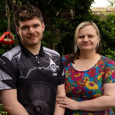 BBC/Chris Waring Ryan and Sarah stand side by side in a garden