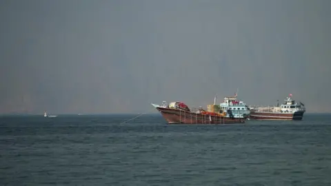 Reuters Smaller vessels anchored in the Strait of Hormuz.
