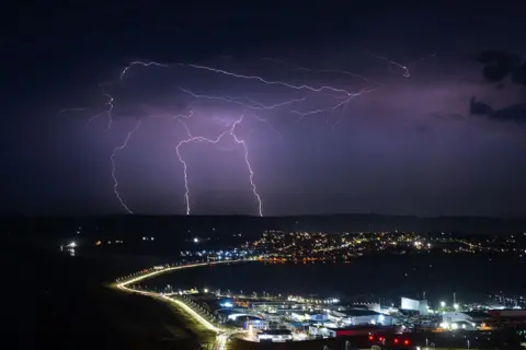 Getty Images Lightning strikes are seen during a storm over Weymouth.