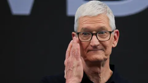 Reuters Apple CEO Tim Cook wipes away a tears while on stage during Apple's annual Worldwide Developers Conference in Cupertino, California, U.S.