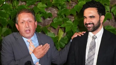 Getty Images Brad Lander, candidate for New York’s 10th Congressional District, stands next to New York City Mayor Zohran Mamdani during a watch party after winning the primary elections in Brooklyn, New York