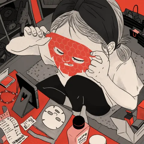 BBC An illustration showing a young girl applying a red sheet mask in front of her phone. She is surrounded by shopping bags, receipts and bottles of cosmetics