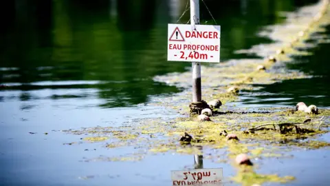 Getty Images A river in France with a danger sign