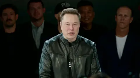 Reuters Elon wears a black leather jacket while speaking ahead of the SpaceX IPO.