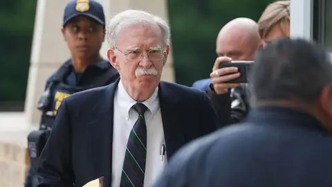 Getty Images John Bolton arrives in court on Friday