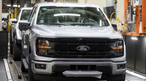 Getty Images A silver Ford F-150 truck on a production line at the carmaker's Michigan factory.


