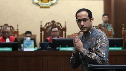 Getty Images Gojek founder Nadiem Makarim appears in court for the verdict in his high profile corruption trial in Jakarta, Indonesia