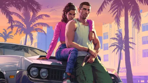 Rockstar Games Cover art of the two protagonists in the game, Jason and Lucia, sitting against a car. Jason is in a white tank top and green trousers and is holding a gun. Lucia is behind him with an arm around his shoulder and wearing a pink top and grey trousers.