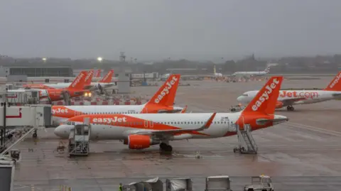 In pictures/Getty Images Easyjet planes on the tarmac at Gatwick airport.