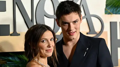 Getty Images Millie Bobby Brown and Louis Partridge attend the Enola Holmes 3 NY Premiere on June 25, 2026 in New York City. 