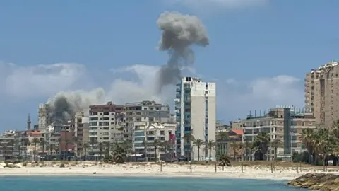 Reuters Smoke billows following an Israeli strike in Tyre, Lebanon (9 June 2026)