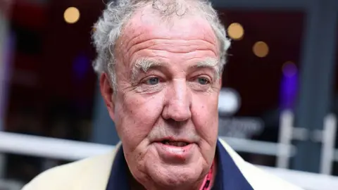 Getty A closeup of TV presenter Jeremy Clarkson with grey hair and eyebrows looking to the right. 