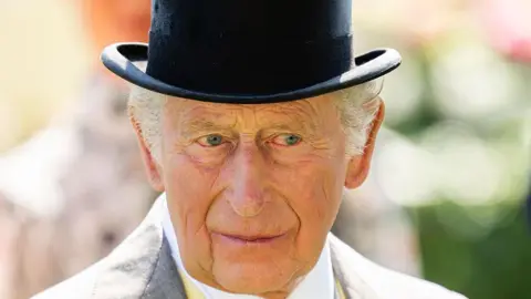 Getty Images King Charles wears a morning suit and top hat at Royal Ascot