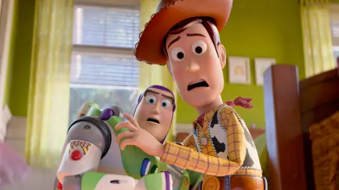 Disney Woody and Buzz Lightyear looking scared in Toy Story 5