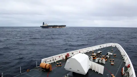Reuters The shadow fleet ship Marinera seen in the distance from the upper decks of a US coastguard cutter following her.