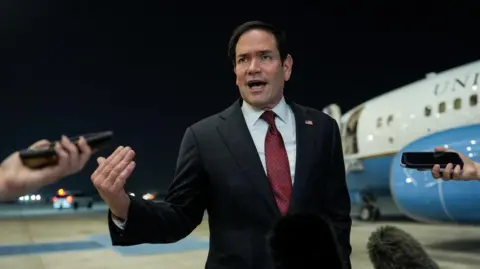 Reuters Secretary of State Marco Rubio speaking to reporters after landing in Abu Dhabi