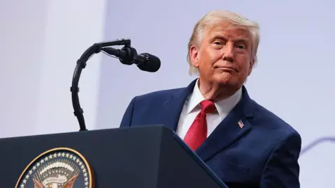 Getty Images US President Donald Trump at the G7 podium. 