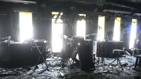 Bangkok Metropolitan Administration The stage setup and instruments at Rong Beer Na Lat Phrao badly charred by the fire