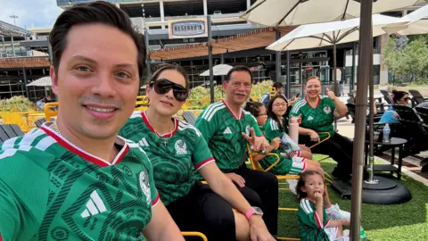 Sergio Enrique Alvarado Montalvo Sergio Enrique Alvarado Montalvo takes a selfie with his family as everyone sports a Mexico jersey.