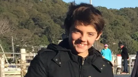 Supplied: Myfanwy Webb A young by with dark hair smiles at the camera