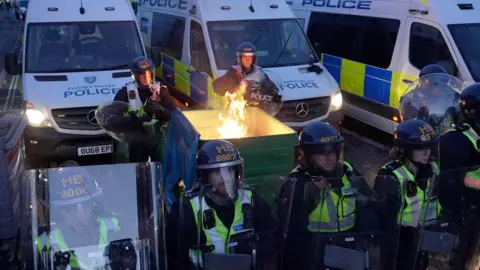 PA Media Screen grab taken from PA Video of police and protestors clashing in Southampton during a protest following the death of Henry Nowak. Vickrum Digwa was jailed at Southampton Crown Court for life with a minimum term of 21 years for the murder of 18-year-old student Henry Nowak.