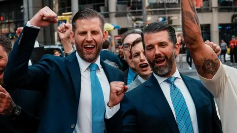AFP via Getty Images World Liberty Financial co-founders Donald Trump Jr (right) and Eric Trump outside the Nasdaq building last year