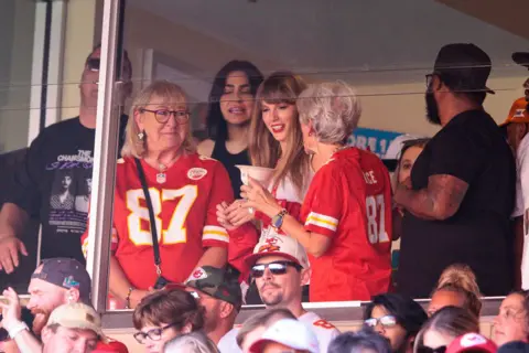 William Purnell/Icon Sportswire via Getty Images Singer Taylor Swift watches the game with Donna Kielce Kansas City Chiefs tight end Travis Kelce (87) mom against the Chicago Bears on September 24th, 2023 at GEHA Field at Arrowhead Stadium in Kansas City, Missouri. 